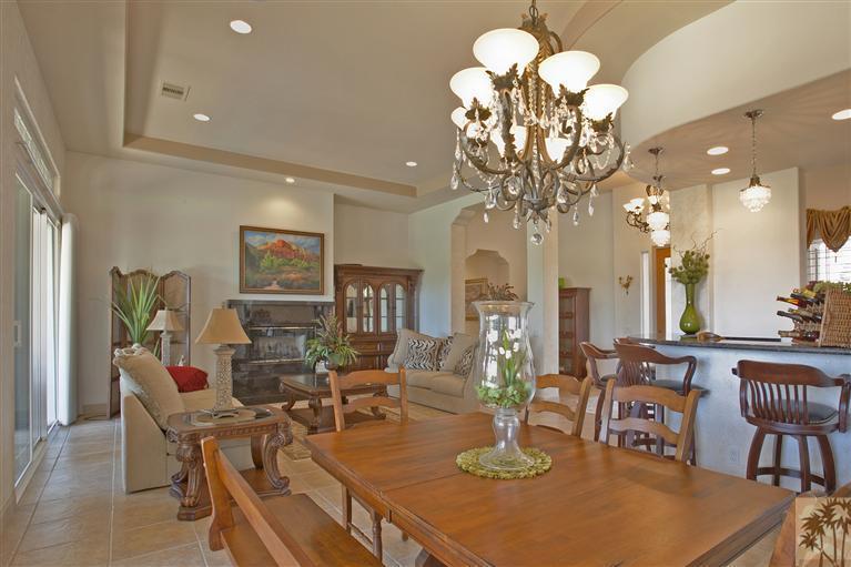 59 Calle Del Norte Rancho Mirage, CA 92270 - Photo 8 of 25 a view of a dining room with furniture a chandelier and wooden floor