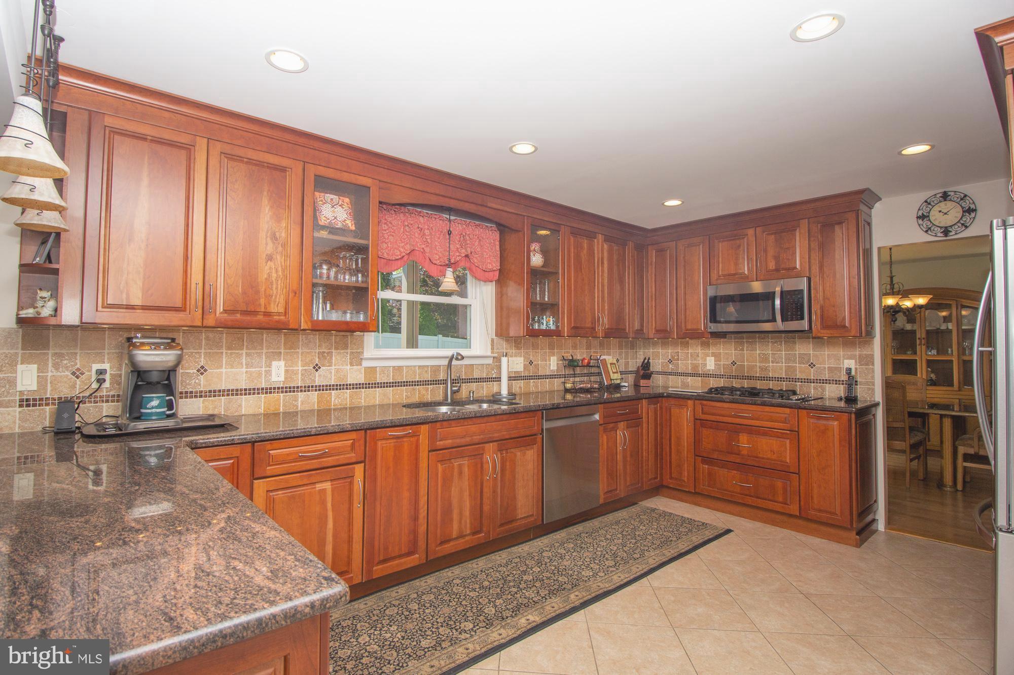 518 Ehret Road Fairless Hills, PA 19030 - Photo 11 of 37 a kitchen with stainless steel appliances granite countertop a stove sink and cabinets