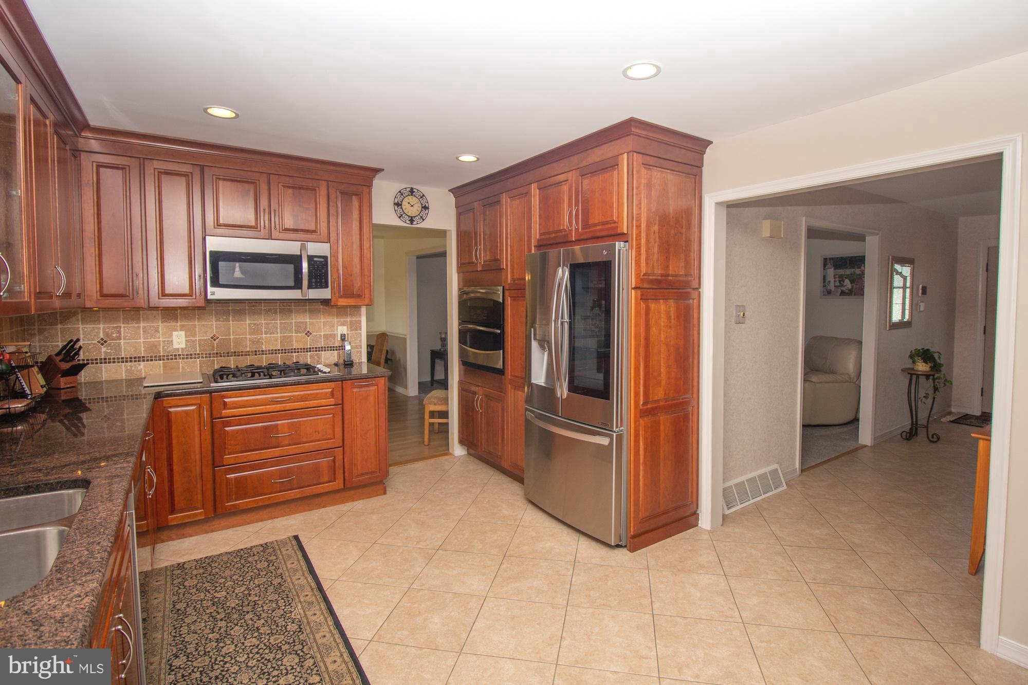 518 Ehret Road Fairless Hills, PA 19030 - Photo 12 of 37 a kitchen with stainless steel appliances granite countertop a refrigerator and a stove top oven