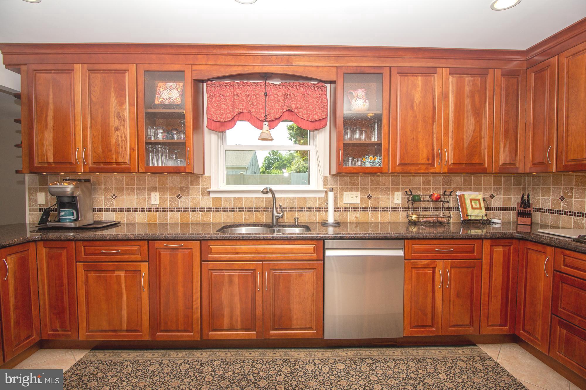 518 Ehret Road Fairless Hills, PA 19030 - Photo 14 of 37 a kitchen with stainless steel appliances granite countertop a stove a sink and a microwave