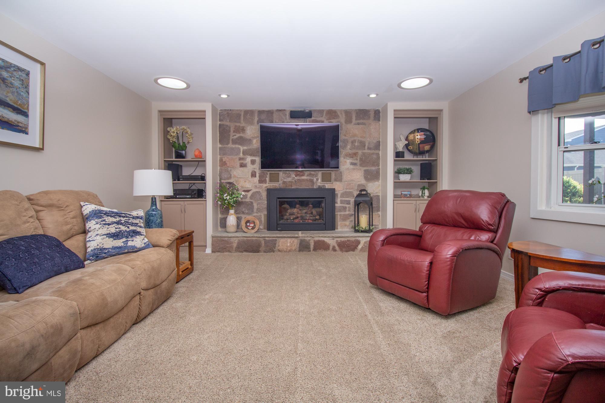 518 Ehret Road Fairless Hills, PA 19030 - Photo 15 of 37 a living room with furniture a flat screen tv and a fireplace