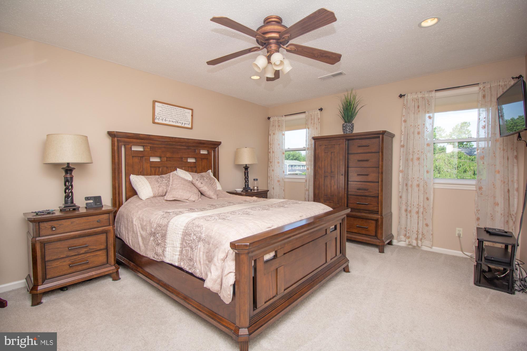 518 Ehret Road Fairless Hills, PA 19030 - Photo 18 of 37 a spacious bedroom with a bed and a tv
