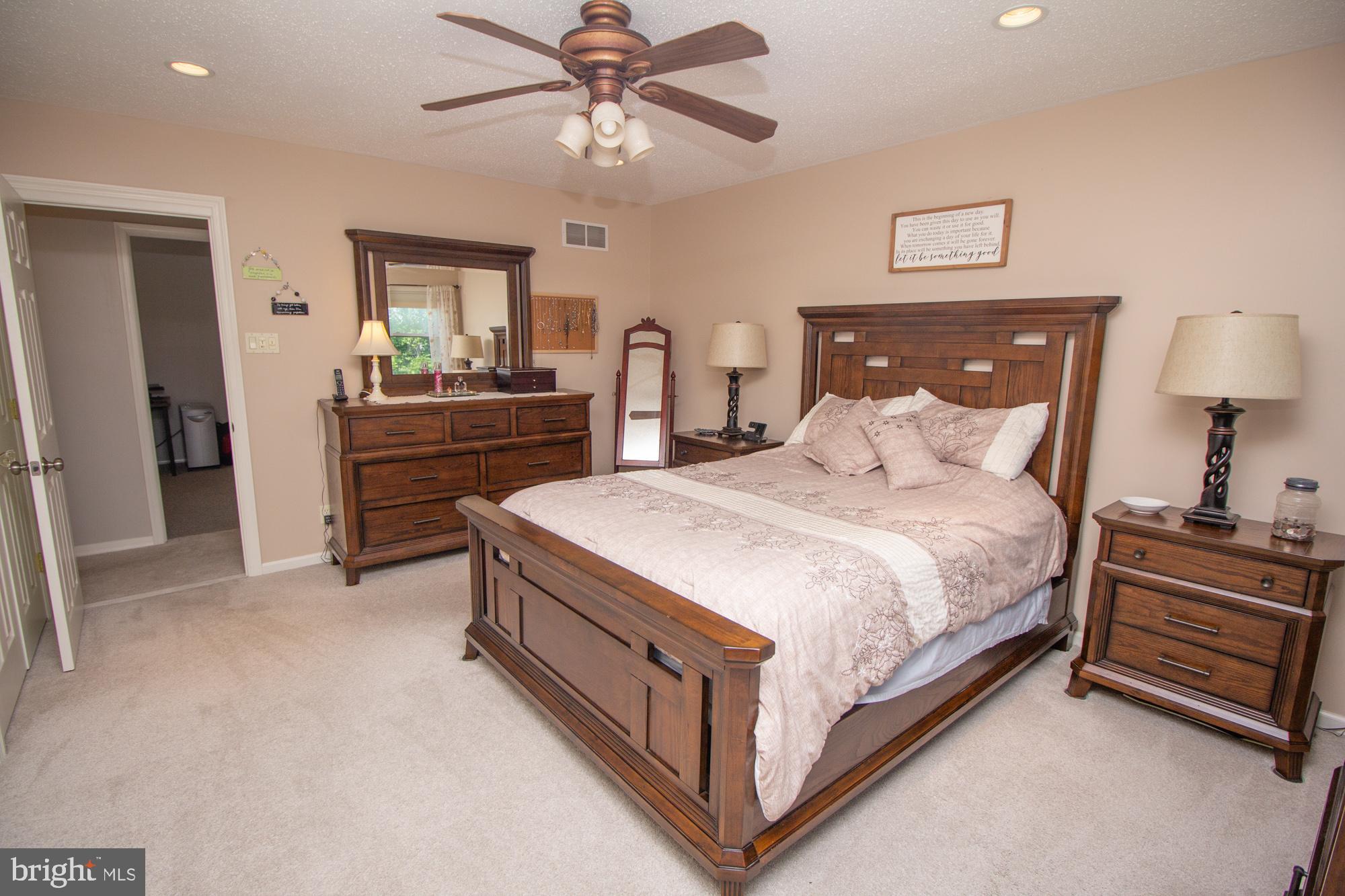 518 Ehret Road Fairless Hills, PA 19030 - Photo 19 of 37 a bedroom with a bed and a chandelier