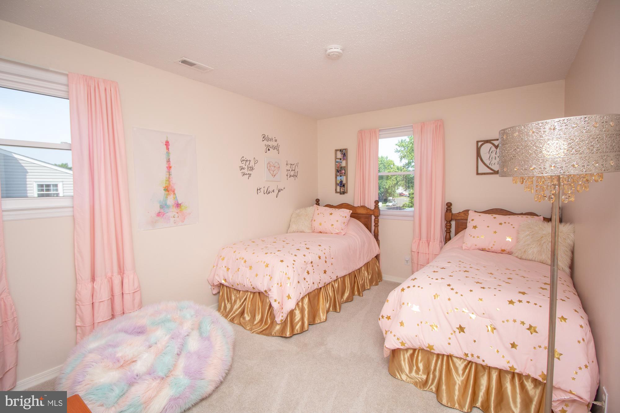 518 Ehret Road Fairless Hills, PA 19030 - Photo 22 of 37 a bedroom with two beds and painting on the wall