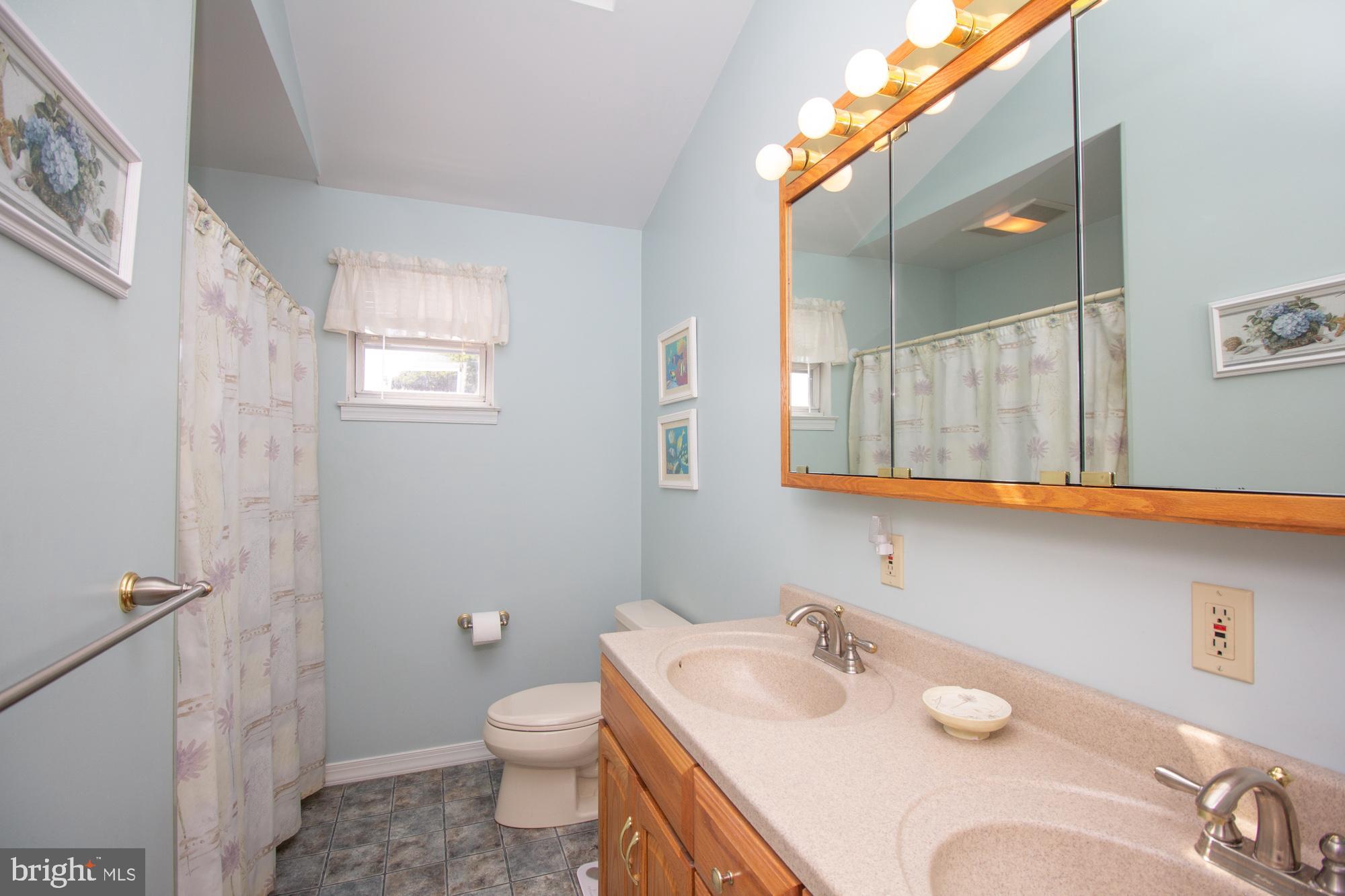 518 Ehret Road Fairless Hills, PA 19030 - Photo 25 of 37 a bathroom with a granite countertop sink and a mirror