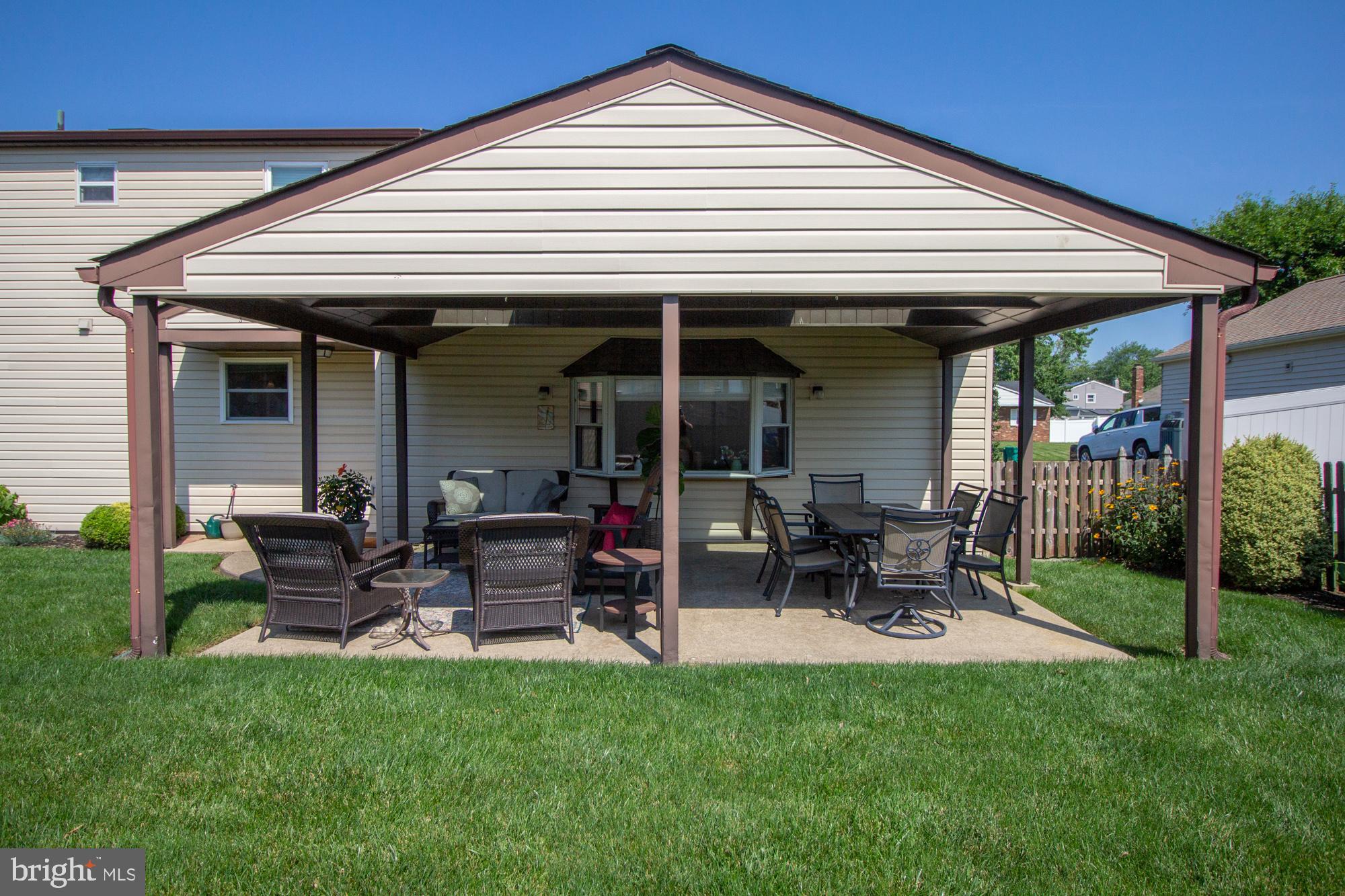 518 Ehret Road Fairless Hills, PA 19030 - Photo 30 of 37 a view of a patio with table and chairs under an umbrella