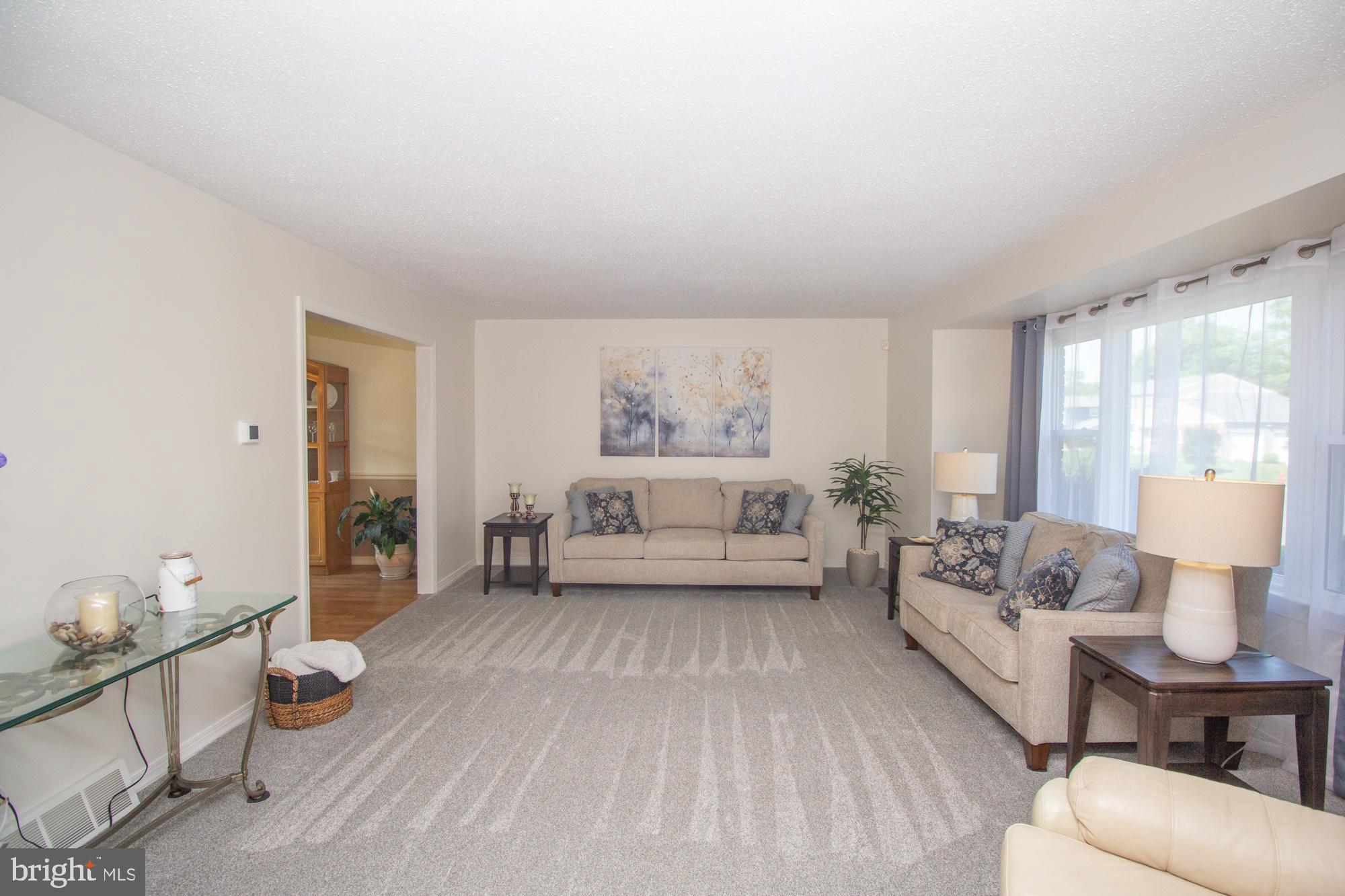 518 Ehret Road Fairless Hills, PA 19030 - Photo 6 of 37 a spacious bedroom with a bed a couch and dresser