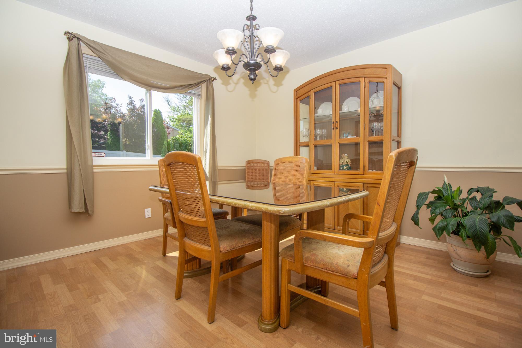 518 Ehret Road Fairless Hills, PA 19030 - Photo 9 of 37 a dining room with furniture potted plants and wooden floor