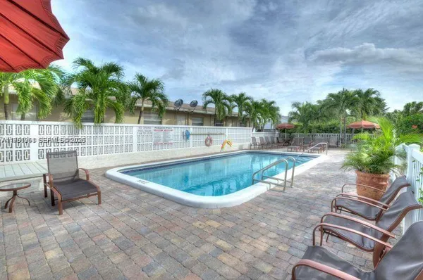 a view of a swimming pool with a patio