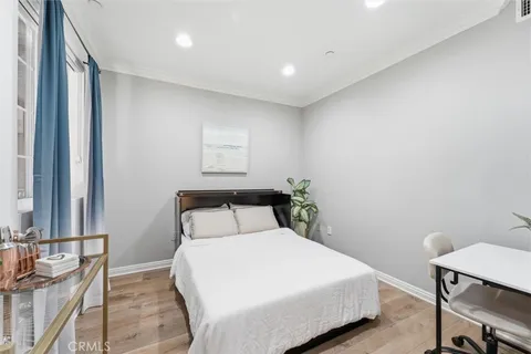 a bedroom with a bed and a lamp