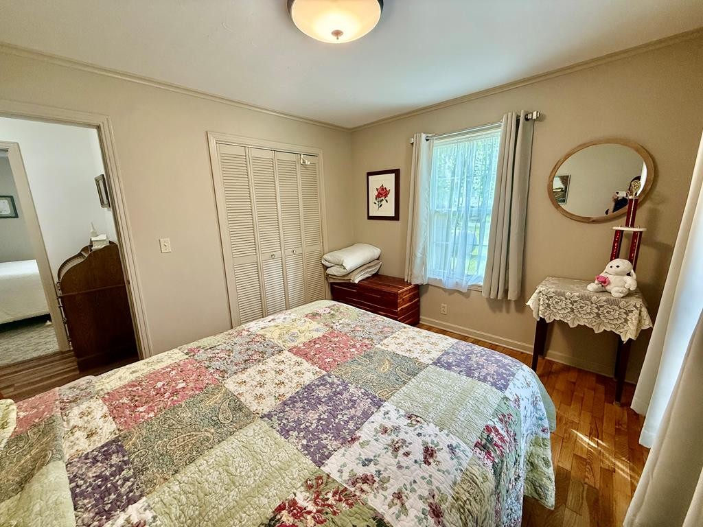 180 Center Drive Springville, TN 38256 - Photo 11 of 30 a bedroom with a bed and dresser with mirror