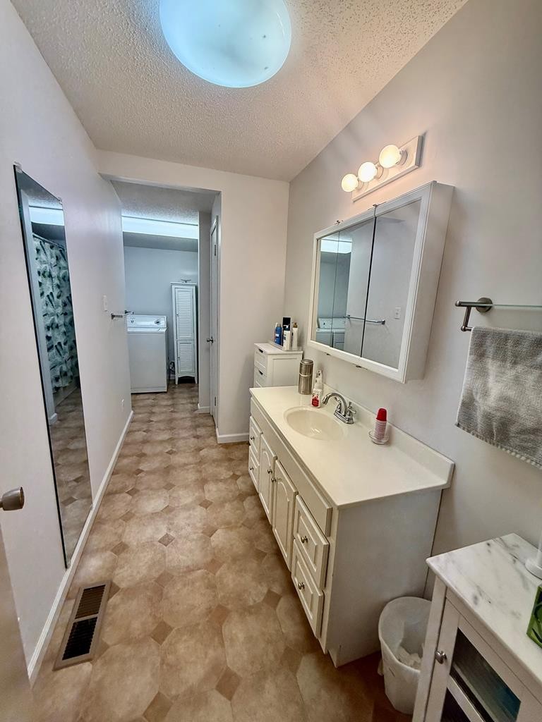 180 Center Drive Springville, TN 38256 - Photo 14 of 30 a bathroom with a double vanity sink mirror and toilet