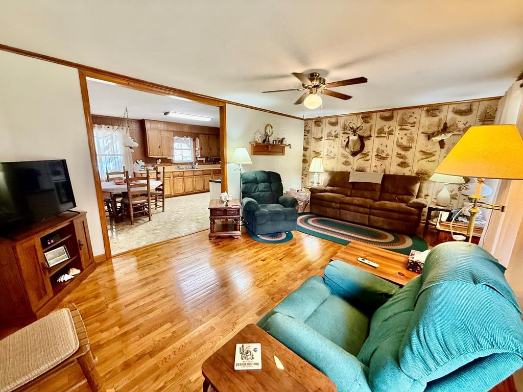180 Center Drive Springville, TN 38256 - Photo 2 of 30 a living room with furniture fireplace and a flat screen tv