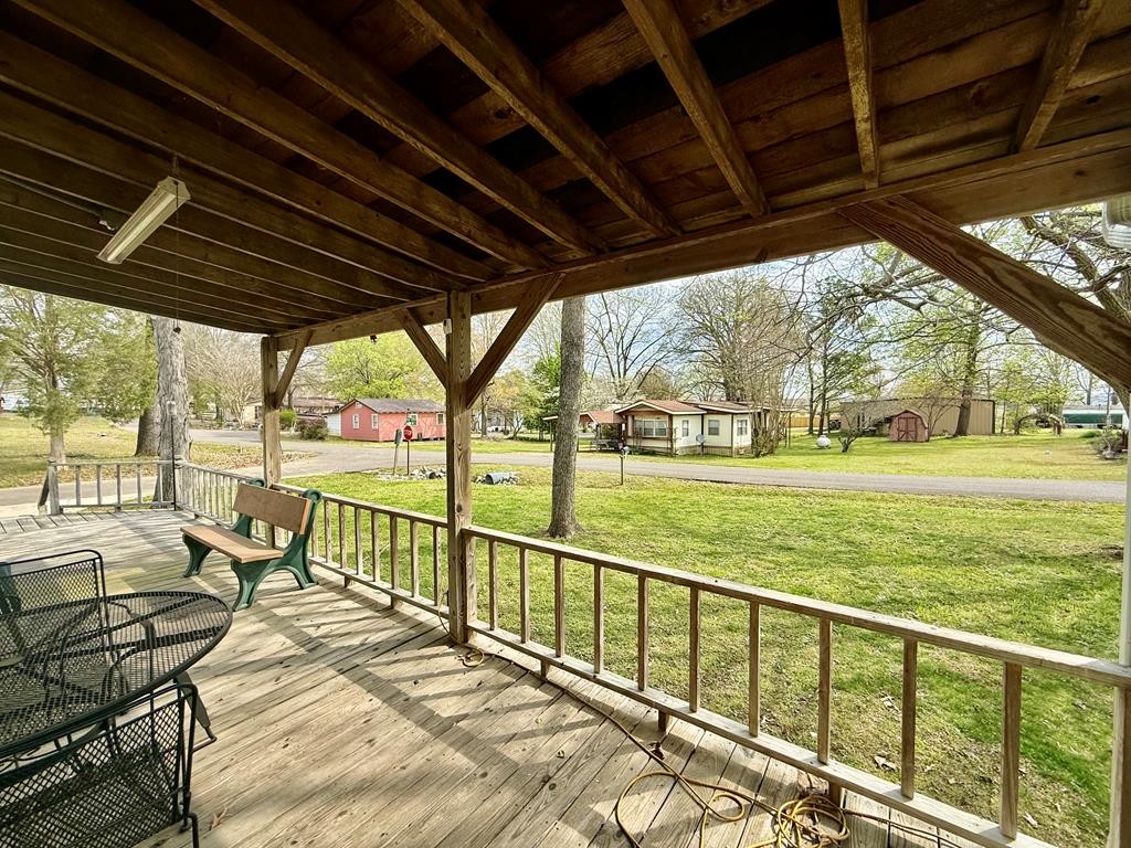 180 Center Drive Springville, TN 38256 - Photo 25 of 30 a view of a porch with furniture and garden