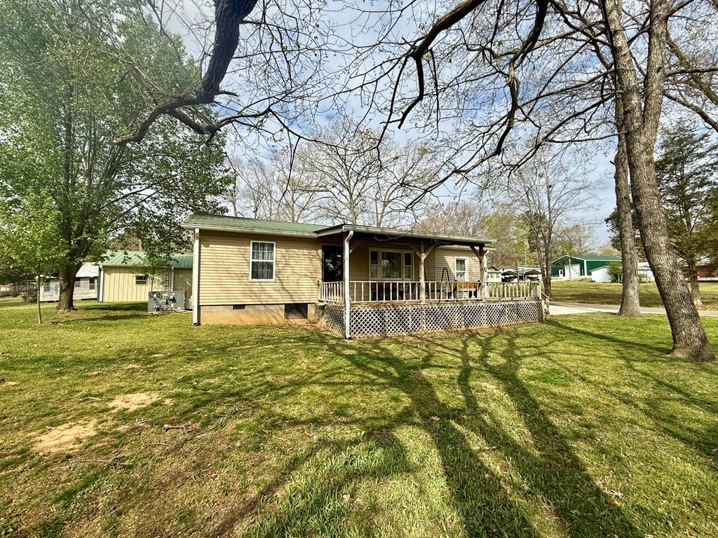 180 Center Drive Springville, TN 38256 - Photo 27 of 30 a front view of a house with a yard