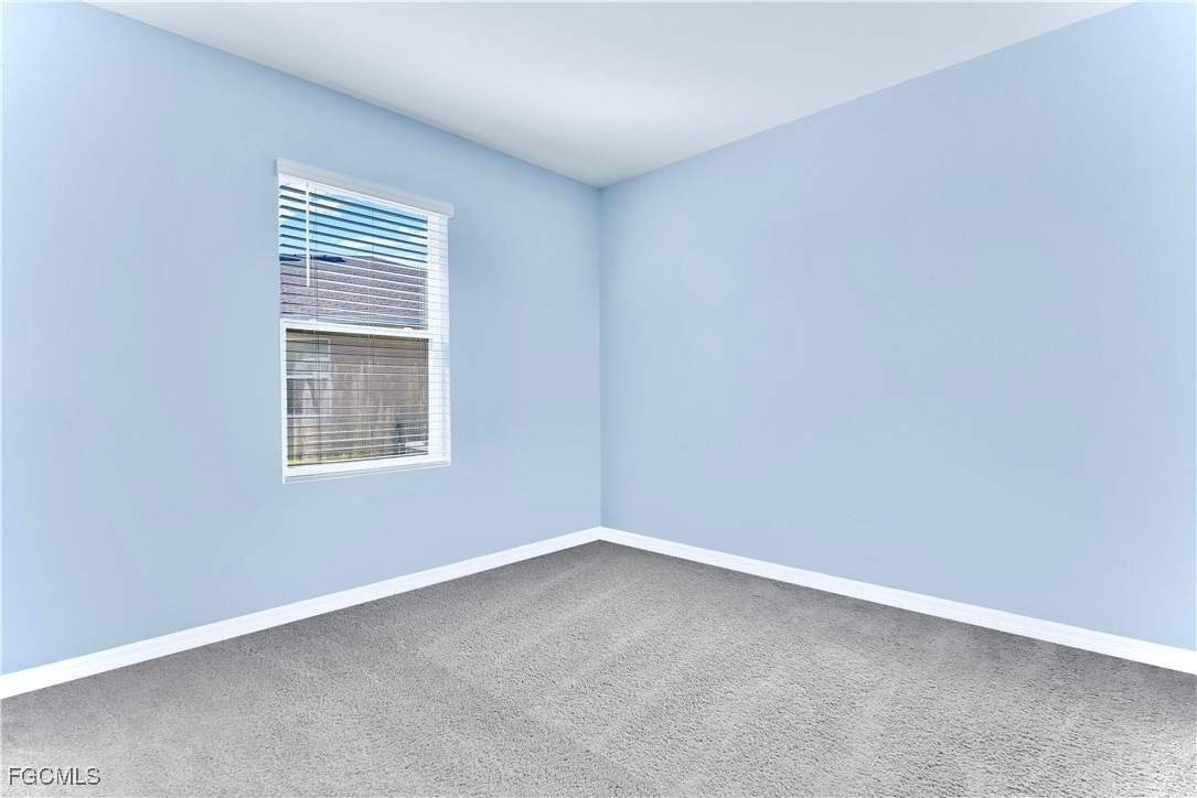 10357 Silver Pond Lane Lehigh Acres, FL 33936 - Photo 11 of 25 an empty room with a window