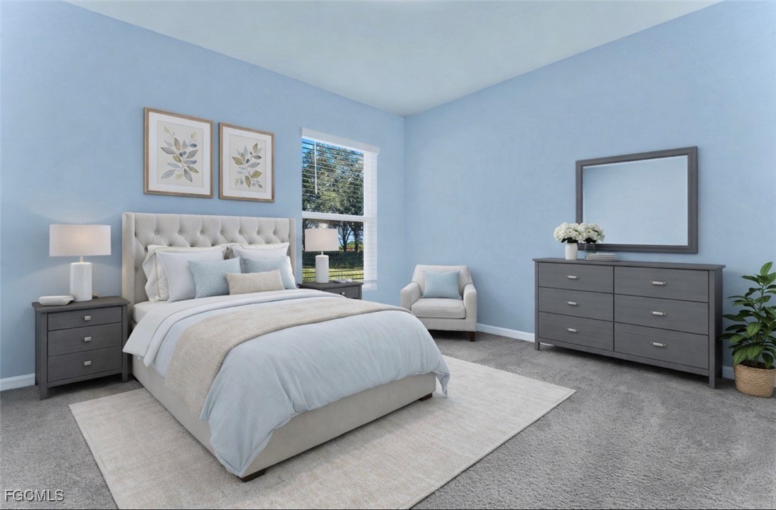 10357 Silver Pond Lane Lehigh Acres, FL 33936 - Photo 12 of 25 a bedroom with a bed and a dresser
