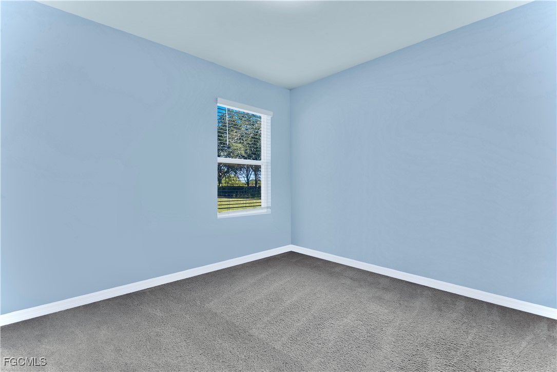 10357 Silver Pond Lane Lehigh Acres, FL 33936 - Photo 13 of 25 an empty room with a window