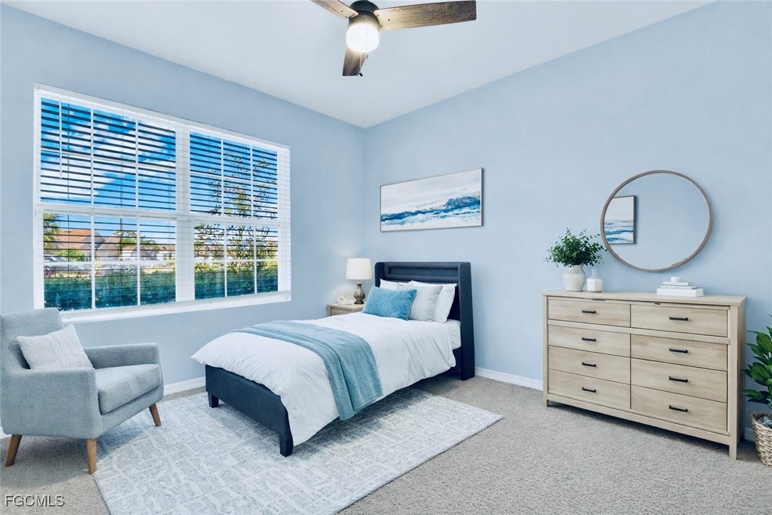 10357 Silver Pond Lane Lehigh Acres, FL 33936 - Photo 15 of 25 a bedroom with a bed and a dresser