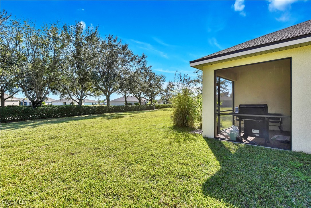 10357 Silver Pond Lane Lehigh Acres, FL 33936 - Photo 17 of 25 a view of a house with a yard