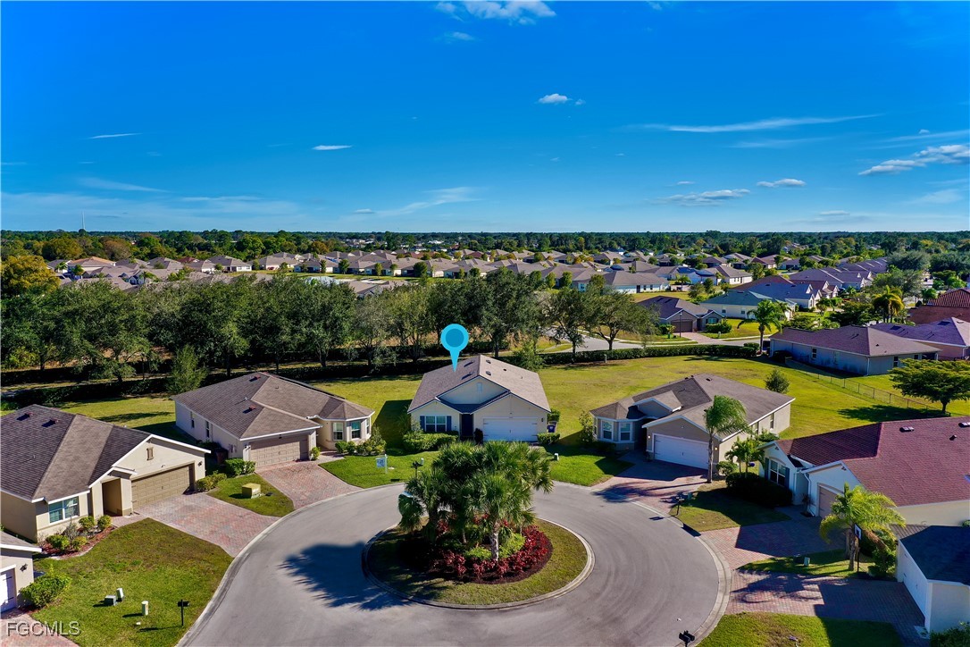 10357 Silver Pond Lane Lehigh Acres, FL 33936 - Photo 19 of 25 a view of swimming pool with outdoor seating and a garden