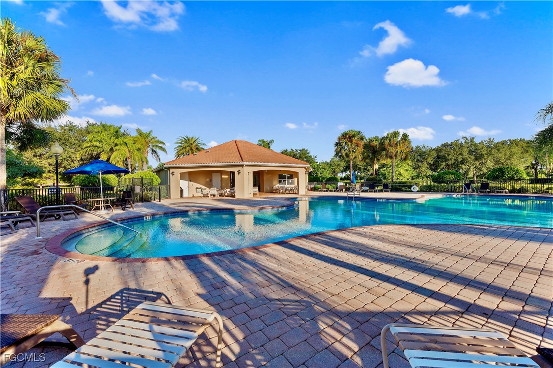 10357 Silver Pond Lane Lehigh Acres, FL 33936 - Photo 21 of 25 a view of a house with a yard