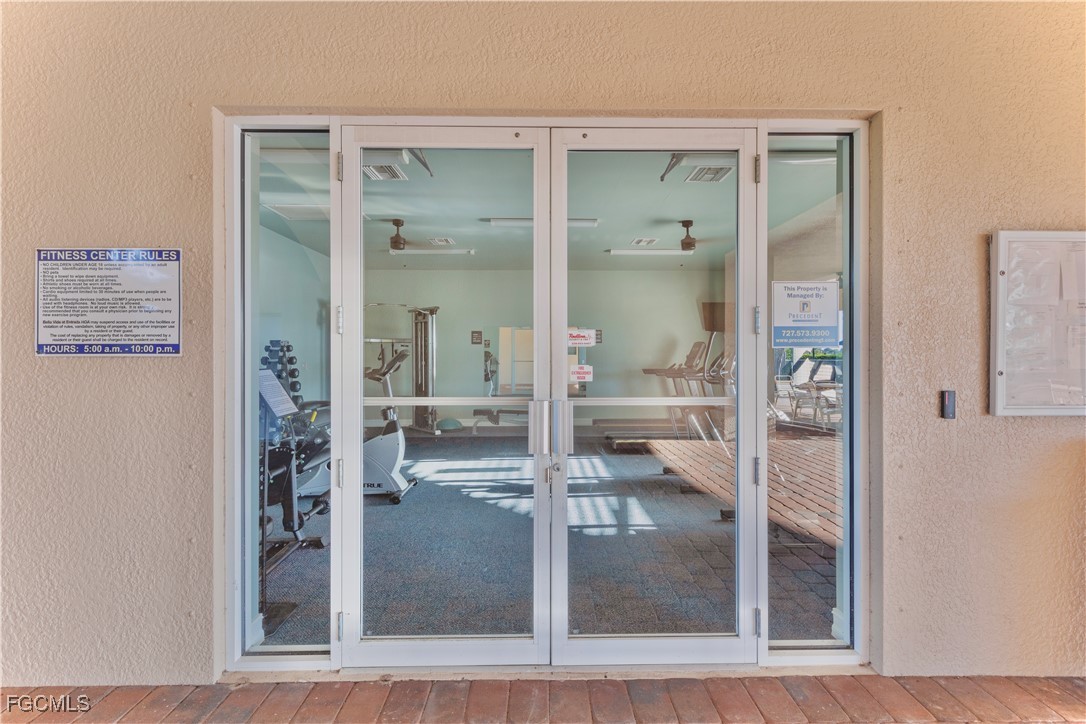 10357 Silver Pond Lane Lehigh Acres, FL 33936 - Photo 25 of 25 a room with wooden floor and a glass door shower