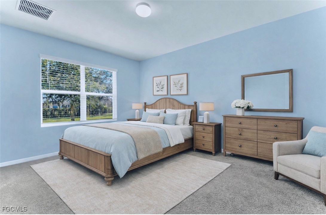 10357 Silver Pond Lane Lehigh Acres, FL 33936 - Photo 5 of 25 a bedroom with a bed and furniture