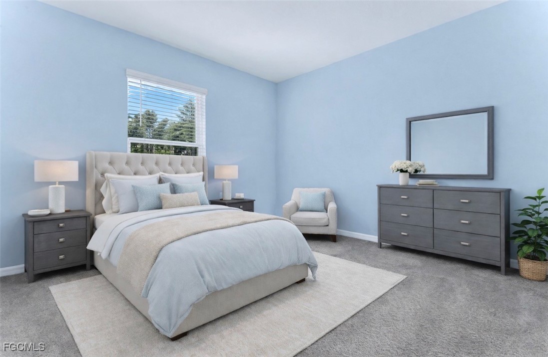 10357 Silver Pond Lane Lehigh Acres, FL 33936 - Photo 10 of 25 a bedroom with a bed and a window