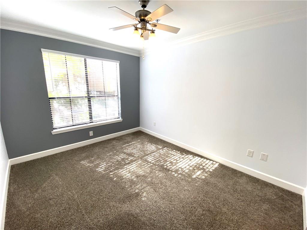 3777 Peachtree Road Northeast, Unit 1517 Atlanta, GA 30319 - Photo 20 of 37 an empty room with a window and a fan