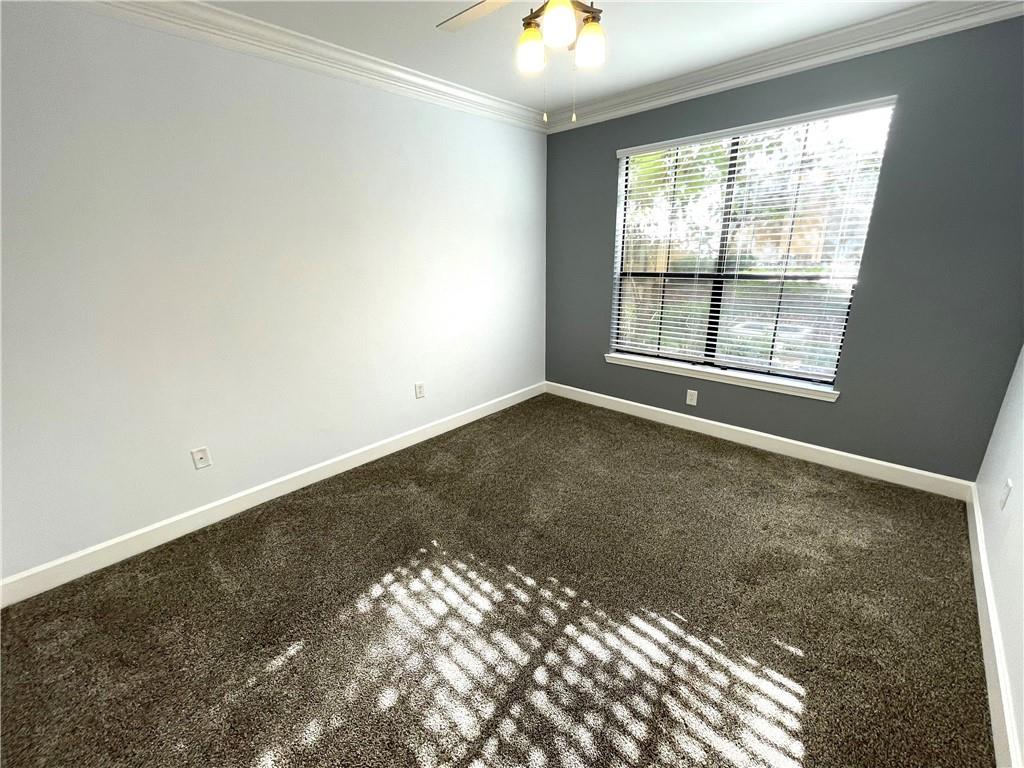 3777 Peachtree Road Northeast, Unit 1517 Atlanta, GA 30319 - Photo 22 of 37 an empty room with a windows