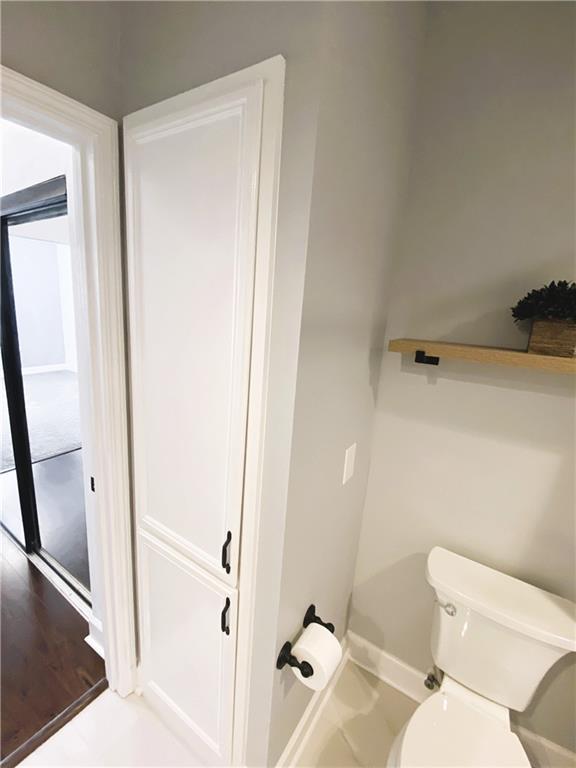 3777 Peachtree Road Northeast, Unit 1517 Atlanta, GA 30319 - Photo 29 of 37 a white toilet sitting next to a bathroom sink