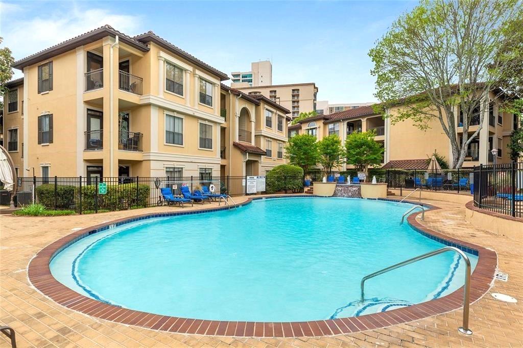3777 Peachtree Road Northeast, Unit 1517 Atlanta, GA 30319 - Photo 32 of 37 a view of a swimming pool with a lounge chairs