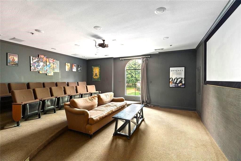 3777 Peachtree Road Northeast, Unit 1517 Atlanta, GA 30319 - Photo 37 of 37 a living room with furniture and a flat screen tv