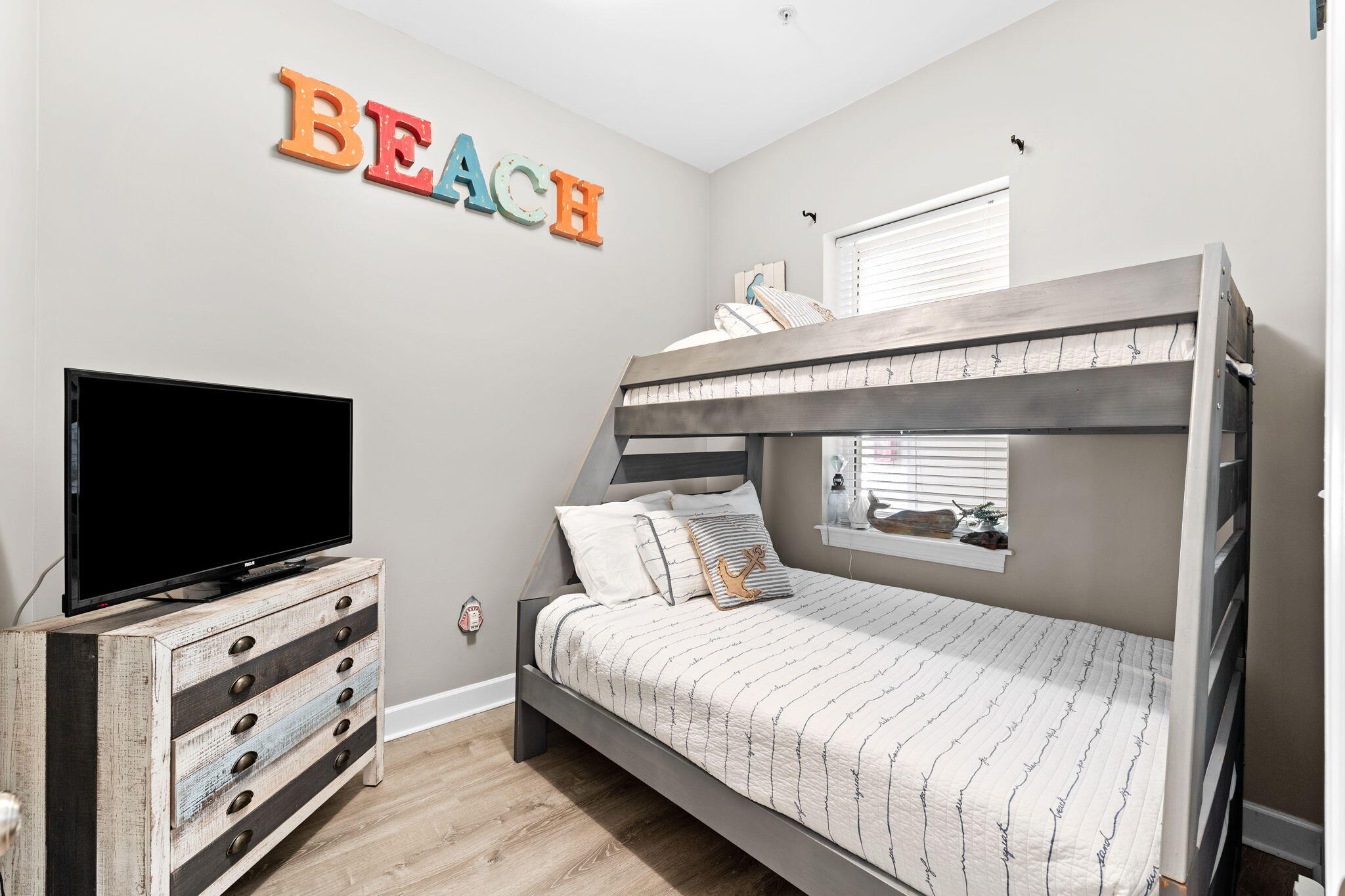 231 Somerset Bridge Road, Unit 1301 Santa Rosa Beach, FL 32459 - Photo 5 of 26 a bedroom with a bed and a flat screen tv
