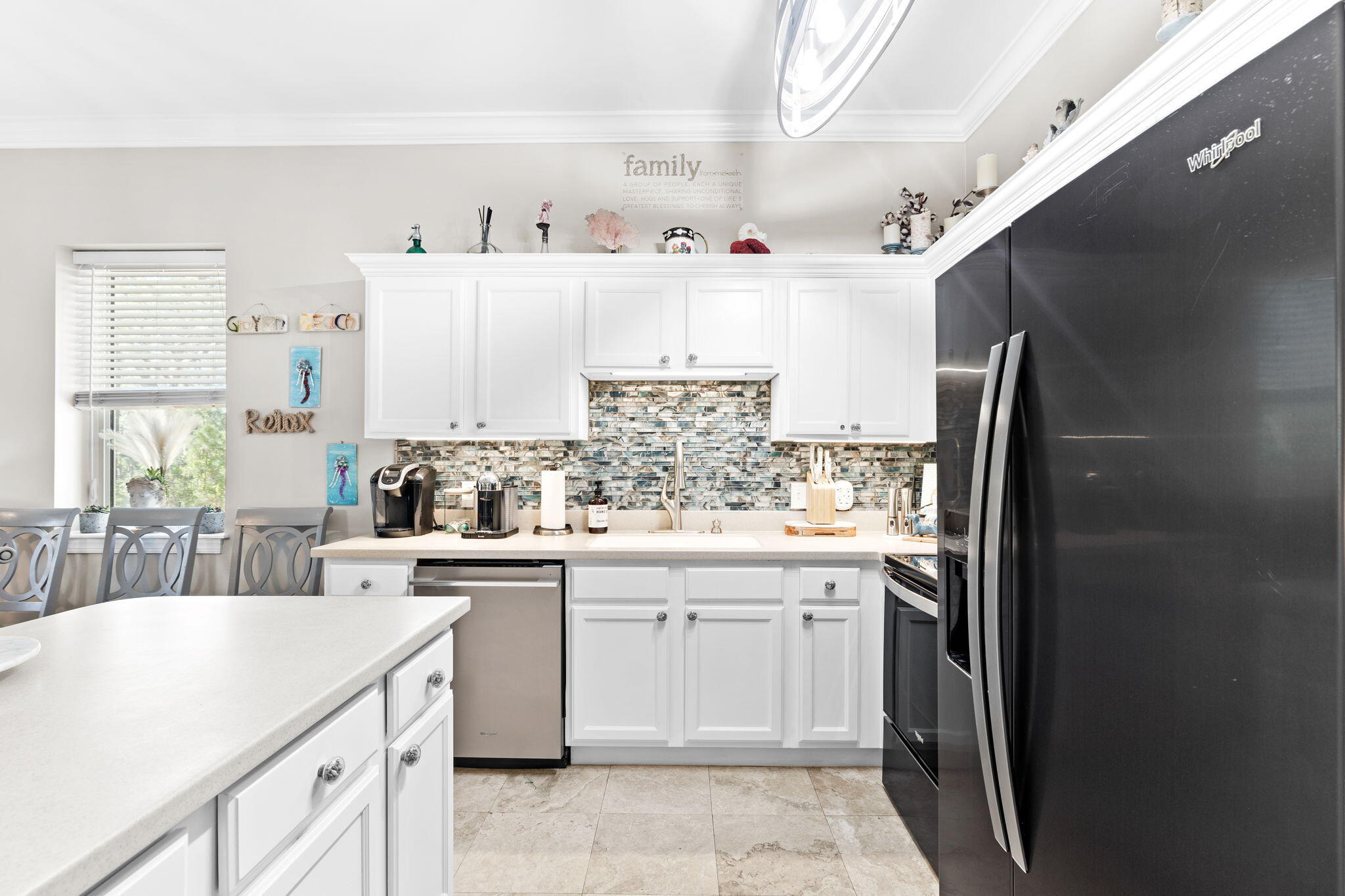 231 Somerset Bridge Road, Unit 1301 Santa Rosa Beach, FL 32459 - Photo 8 of 26 a kitchen with a sink stove and cabinets