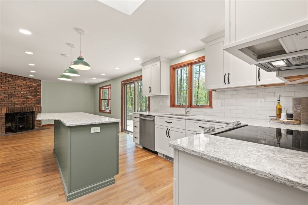 2 Briggs Pond Way Sharon, MA 02067 - Photo 16 of 42 a kitchen with stainless steel appliances granite countertop a sink counter space and wooden floor