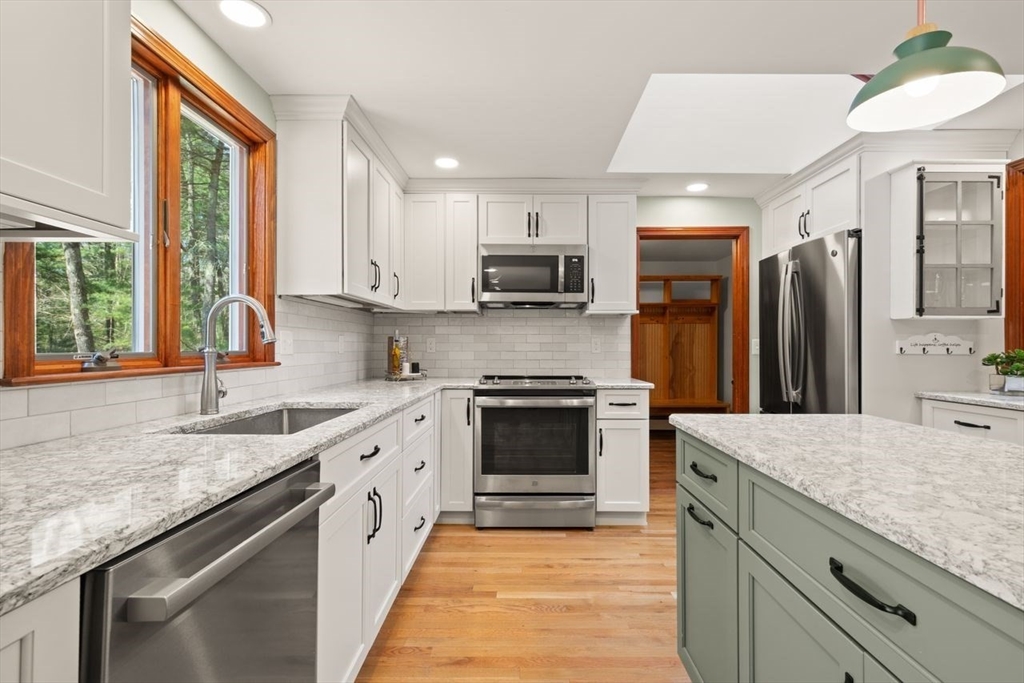 2 Briggs Pond Way Sharon, MA 02067 - Photo 19 of 42 a kitchen with granite countertop a sink stove and refrigerator