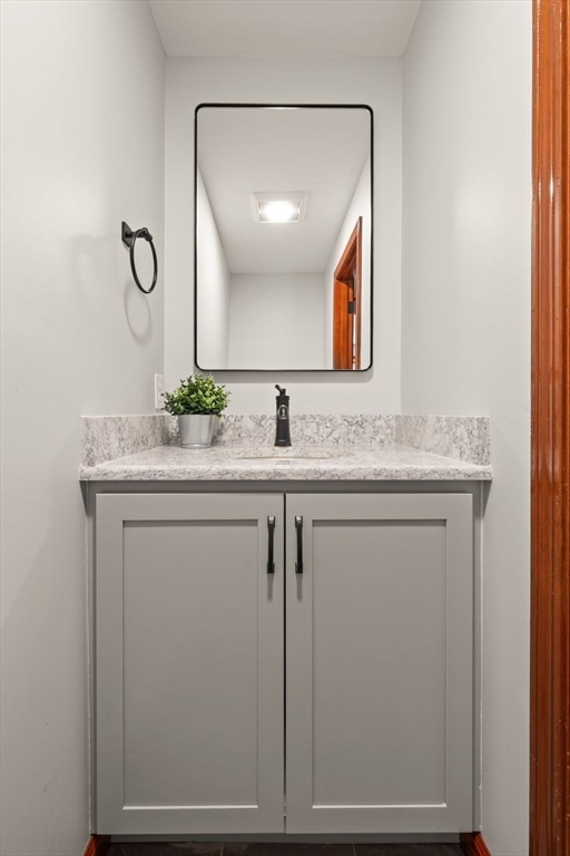 2 Briggs Pond Way Sharon, MA 02067 - Photo 20 of 42 a bathroom with a granite countertop sink and a mirror