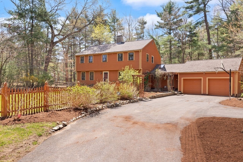 2 Briggs Pond Way Sharon, MA 02067 - Photo 39 of 42 a front view of a house with a yard and garage