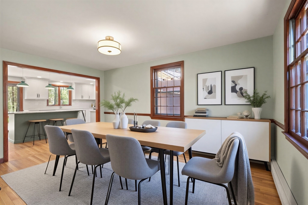 2 Briggs Pond Way Sharon, MA 02067 - Photo 10 of 42 a view of a dining room with furniture and wooden floor