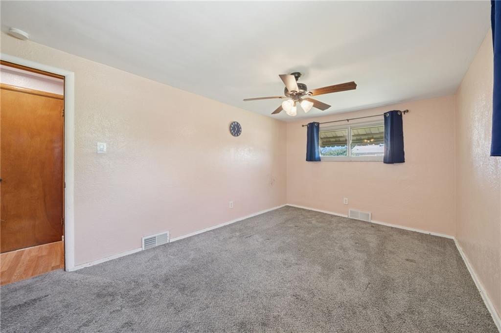 1202 Old Concord Road Monroeville, PA 15146 - Photo 14 of 27 an empty room with a window and a ceiling fan