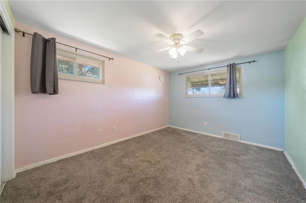 1202 Old Concord Road Monroeville, PA 15146 - Photo 16 of 27 an empty room with windows and fan