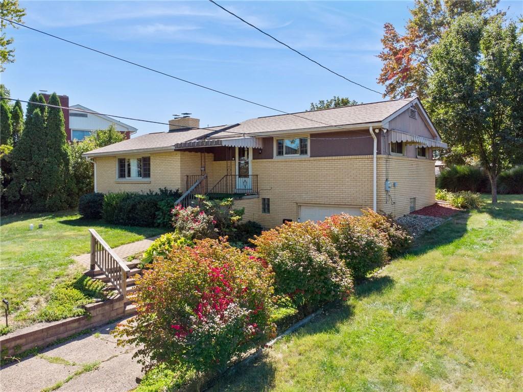 1202 Old Concord Road Monroeville, PA 15146 - Photo 2 of 27 a front view of house with yard and green space