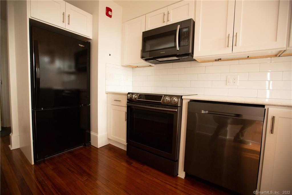 70 South Main Street, Unit 3B Norwalk, CT 06854 - Photo 5 of 21 a kitchen with cabinets and steel stainless steel appliances