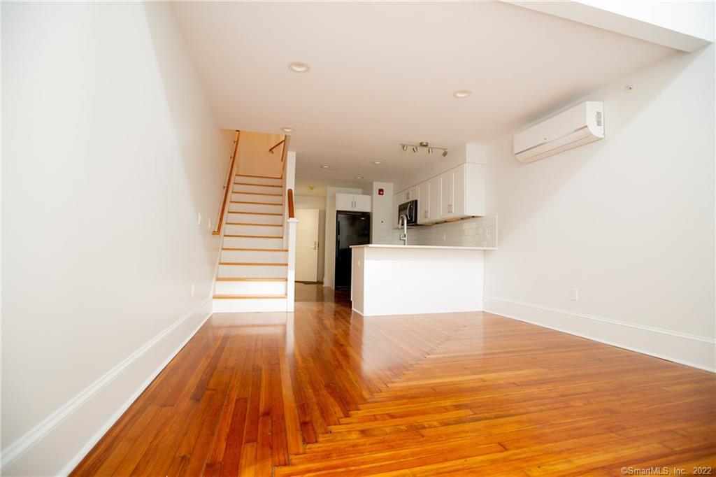 70 South Main Street, Unit 3B Norwalk, CT 06854 - Photo 9 of 21 a view of a kitchen with wooden floor