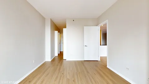 a view of hallway with wooden floor