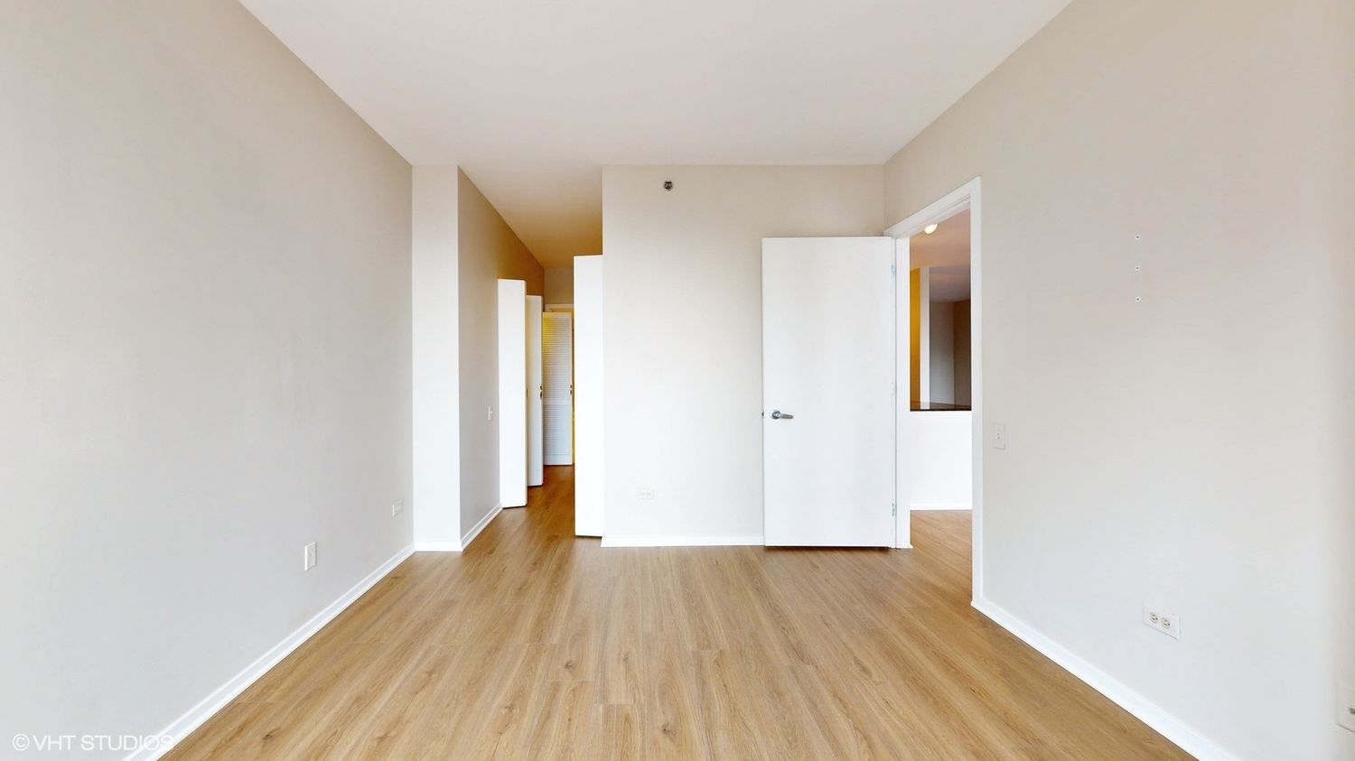 210 South Desplaines Street, Unit 907 Chicago, IL 60661 - Photo 12 of 17 a view of hallway with wooden floor