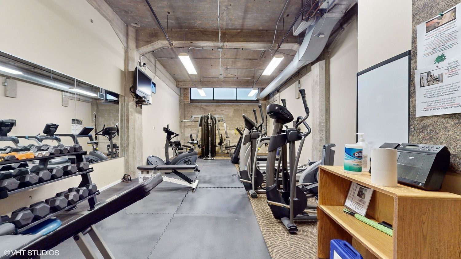 210 South Desplaines Street, Unit 907 Chicago, IL 60661 - Photo 16 of 17 a view of a room with gym equipment