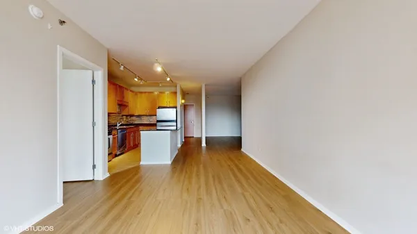 a view of a living room with wooden floor